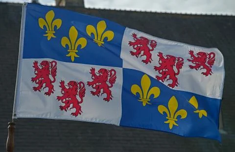 Normandy flag waving on wind in front of castle Stock Photos