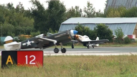North American long-range fighter P-51 Mustang steers along runway. Stock Footage 117542130