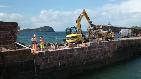 North Berwick Harbour repairs after storm damge Stock Footage 276922571
