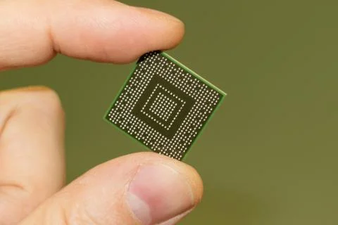 North bridge computer bga chip in hand, on the side of the contacts Stock Photos