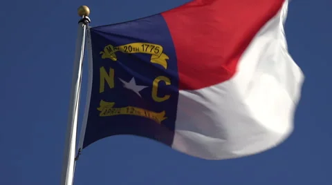 north carolina flag in wind with blue sk... | Stock Video | Pond5