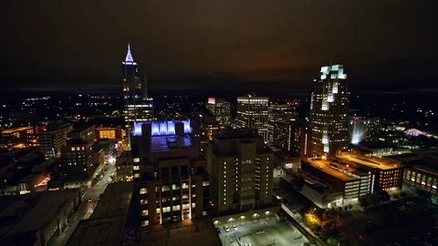 North Carolina Raleigh Aerial v5 Panning around from cityscape to downtown views Stock Footage