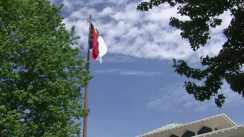 North Carolina State Legislature Building. Tilt Down From NC Flag Stock Footage