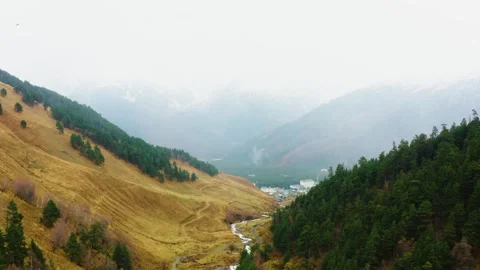 North Caucasus Mountain Valley with River and Village Stock Footage 320852940