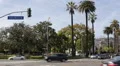 North Doheny Drive Crossing Santa Monica Boulevard Car Traffic Commuters Commute HD Footage