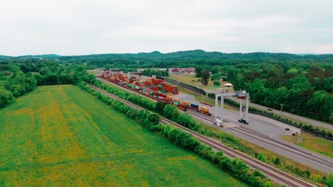 North Georgia rail corridor: freight train and container terminal set among Stock Footage 340185088