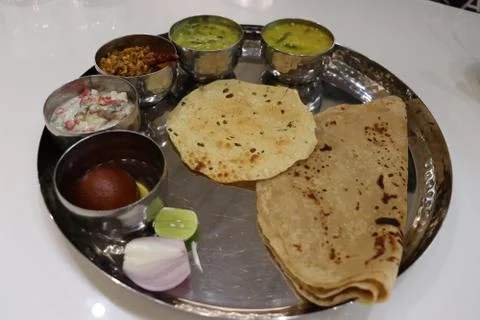 North Indian thali consisting of multiple bowls full of curries Stock Photos