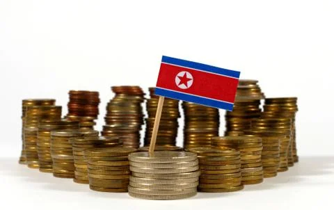 North Korea flag waving with stack of money coins Stock Photos