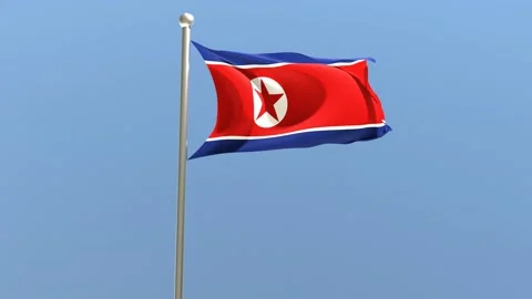 North Korean flag on flagpole. DPRK flag fluttering in the wind.	 Stock Footage 168476786