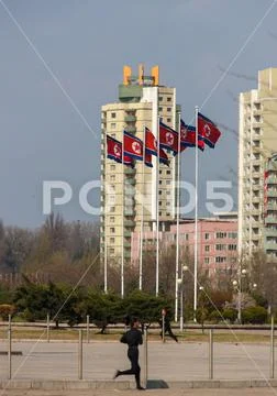 North Korean people running in the middle of buildings, Pyongan Province, Pyo Stock Photos