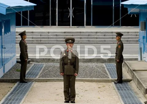 North Korean soldiers standing in front of the United Nations conference room Stock Photos