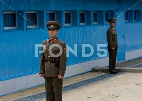 North Korean soldiers standing in front of the United Nations conference room Stock Photos