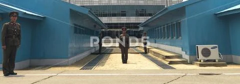 North Korean soldiers standing in front of the United Nations conference room Stock Photos