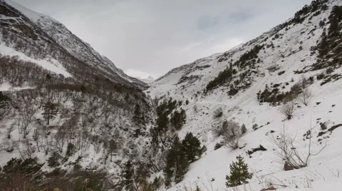 North Ossetia. The movement of clouds in the snowy Caucasus mountains in winter Видео 61452350