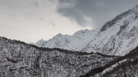 North Ossetia. The movement of clouds in the snowy Caucasus mountains in winter Stock Footage 61452452