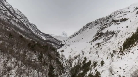 North Ossetia. The movement of clouds in the snowy Caucasus mountains in winter Stock Footage 61452655