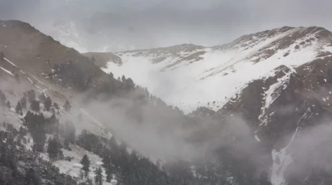 North Ossetia. The movement of clouds in the snowy Caucasus mountains in winter Видео 61453154