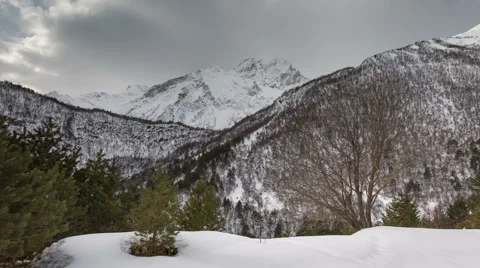 North Ossetia. The movement of clouds in the snowy Caucasus mountains in winter Stock Footage 61454776