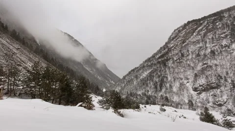 North Ossetia. The movement of clouds in the snowy Caucasus mountains in winter Видео 61455104