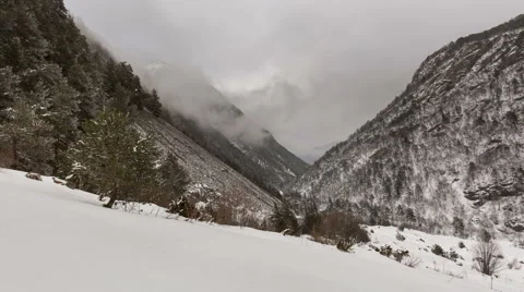 North Ossetia. The movement of clouds in the snowy Caucasus mountains in winter Видео 61455875
