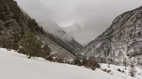North Ossetia. The movement of clouds in the snowy Caucasus mountains in winter. Stock Footage 61456192