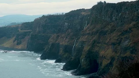 Northern Ireland cliffs overlooking the sea on a misty Irish morning Stock Footage 320623368