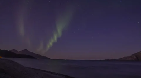 Northern light (aurora borealis) in a fjord after dawn 4K Stock Footage