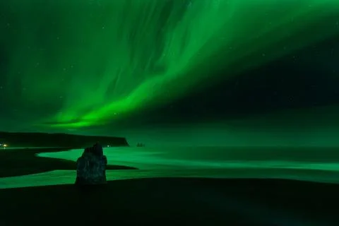 The Northern Light at the Vik Cliffs Iceland. Landscape of Vik beach. Stock Photos