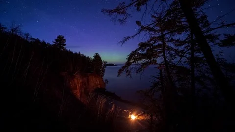Northern lights and campfire down on the beach Stock Footage 72870338