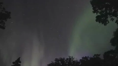 Northern Lights with cloud like shapes with some purple and green tint Stock Footage 172783206