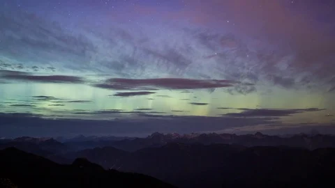 Northern lights dancing behind a thin layer of clouds timelapse Stock Footage 73240801