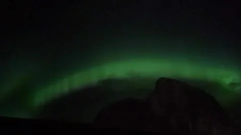 Northern Lights Dancing with Mountain Background in the Lofoten Islands, Norway Stock Footage 340761490