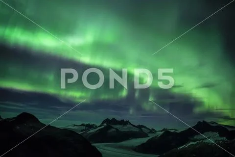 Northern Lights glowing over the Juneau Icefield, Tongass National Forest Stock Photos