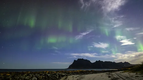 Northern Lights in moonlight on the beach Stock Footage 250441919