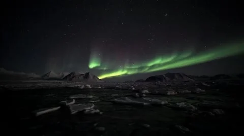 Northern Lights over the frozen Arctic fjord Stock Footage