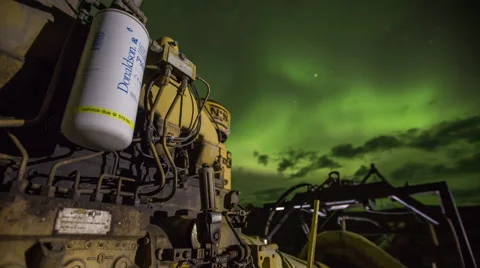 Northern lights over lit machinery Stock Footage 62508564