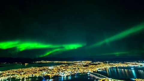Northern Lights over Tromso city, Norway - time-lapse from Fjellheisen Stock Footage