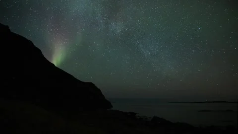 Northern lights timelapse over the ocean in Nyksund, Norway Stock Footage 245488987