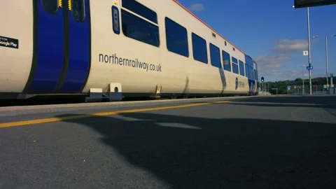 Northern rail train pulling into station Stock Footage 346771979