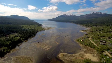 Northern river flows into the sea. The span of the drone over shallow water Stock Footage 104576863
