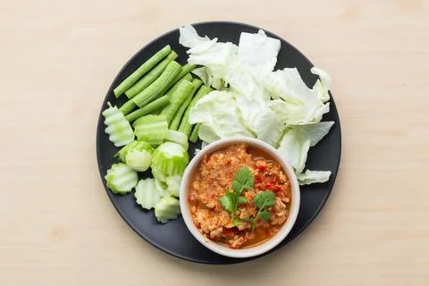 Northern Thai style chilli paste "Nam Pric Ong" with vegetable in black pla.. Stock Photos