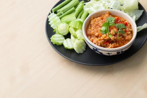 Northern Thai style chilli paste "Nam Pric Ong" with vegetable in black pla.. Stock Photos