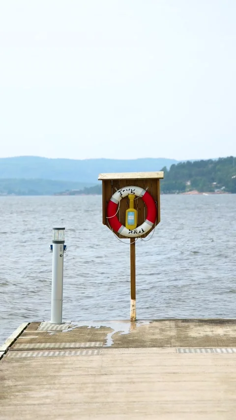 Norway life saving device pir water sea overcast day summer boat crossing in Stock Footage 201683998