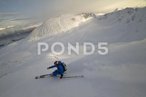 Norway, Mature Man Skiing On Step Mountain