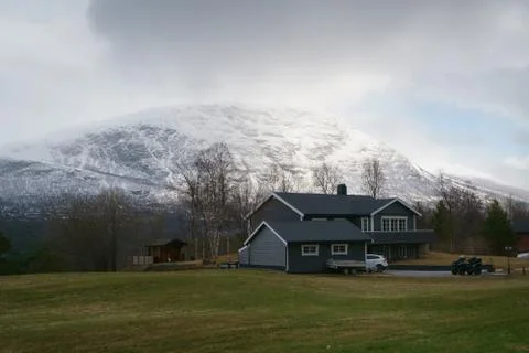 Norway - May 1, 2018: Norway countryside. Classic wooden houses near mountains Stock Photos