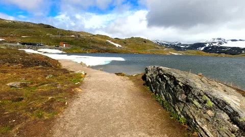 Norway mountain path glacial lake first person POV HDR, HFR Stock Footage 217373387