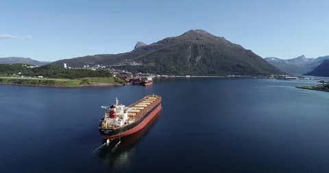 NORWAY, NARVIK - SEPTEMBER 1, 2018: Aerial footage of a cargo ship on the open s Stock Footage 95759215