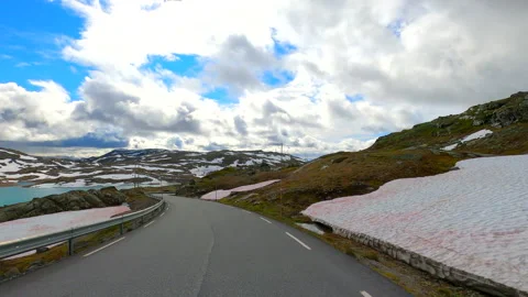 Norway road including bends crossing mountains remote landscape HDR, HFR Stock Footage 217376857