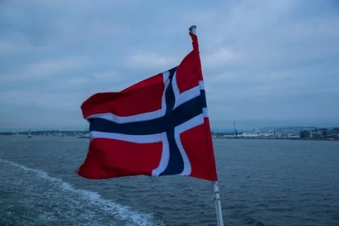 Norway's floating flag captured by wind at sea during sailing. 스톡 사진