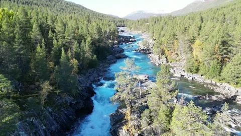 Norway’s Turquoise River Flowing Through Green Landscapes | Drone Footage Stock Footage 323378852